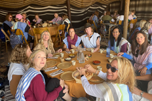 ICEJ-Women from the tour enjoying a meal in "Abraham's Tent"