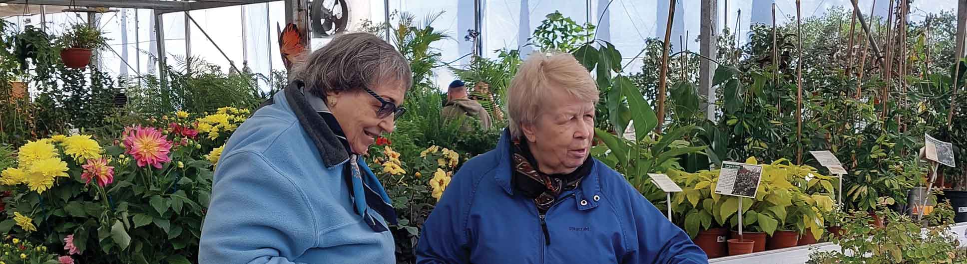 Holocaust Survivors admiring the nursery flowers