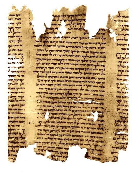 An image of the Isaiah Scroll in an article answering the question "Who Wrote the Dead Sea Scrolls?"