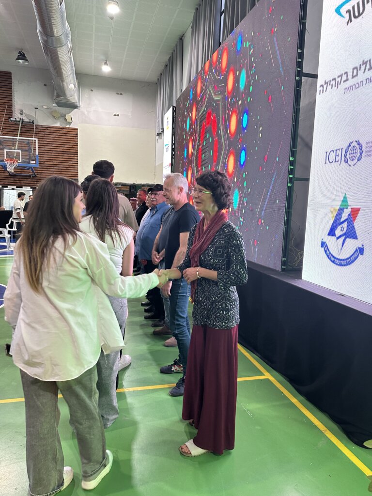 ICEJ AID Assistant Jannie Tolhoek congratulates Israeli Druze students