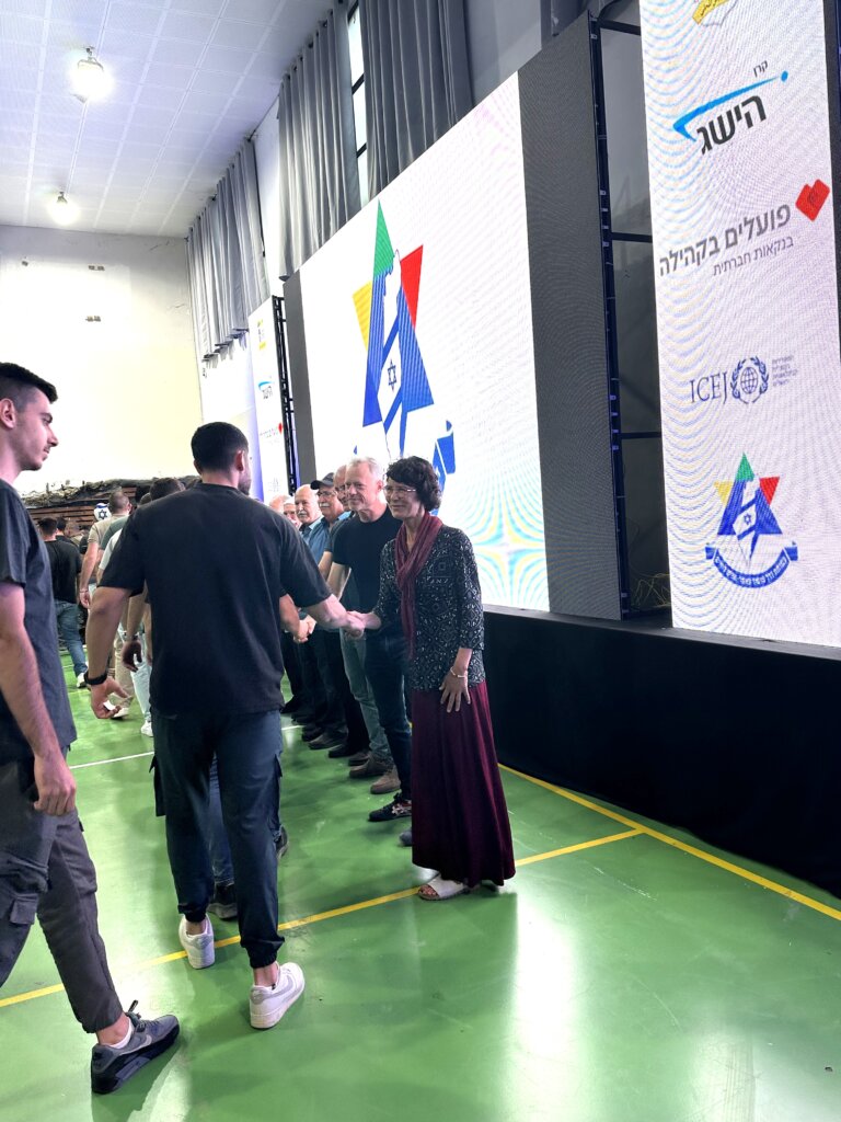 ICEJ AID Assistant Jannie Tolhoek congratulates Israeli Druze students