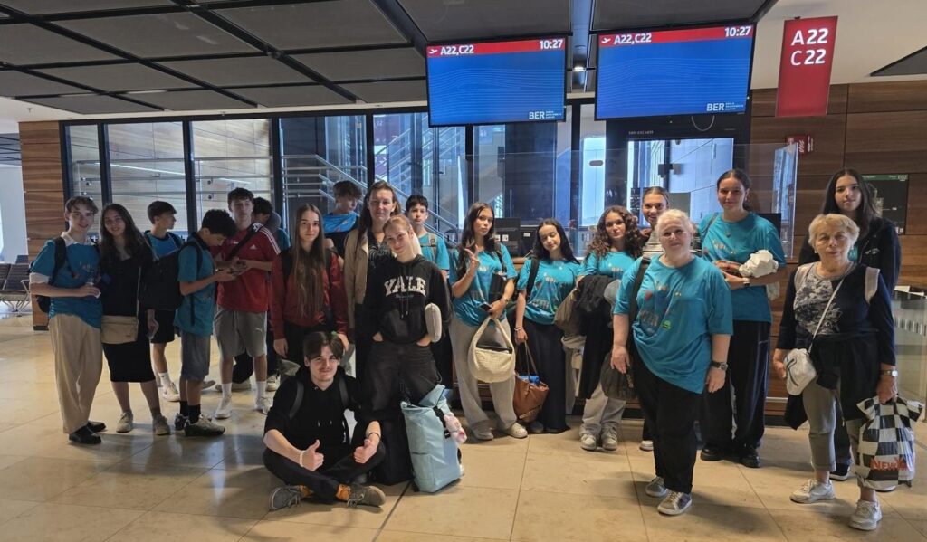 From Germany, a group of students arrive at the airport