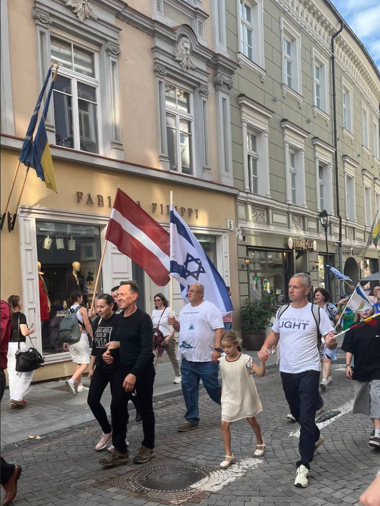 Jewish people march their flags in the street in picture in an article about God's end-time plan