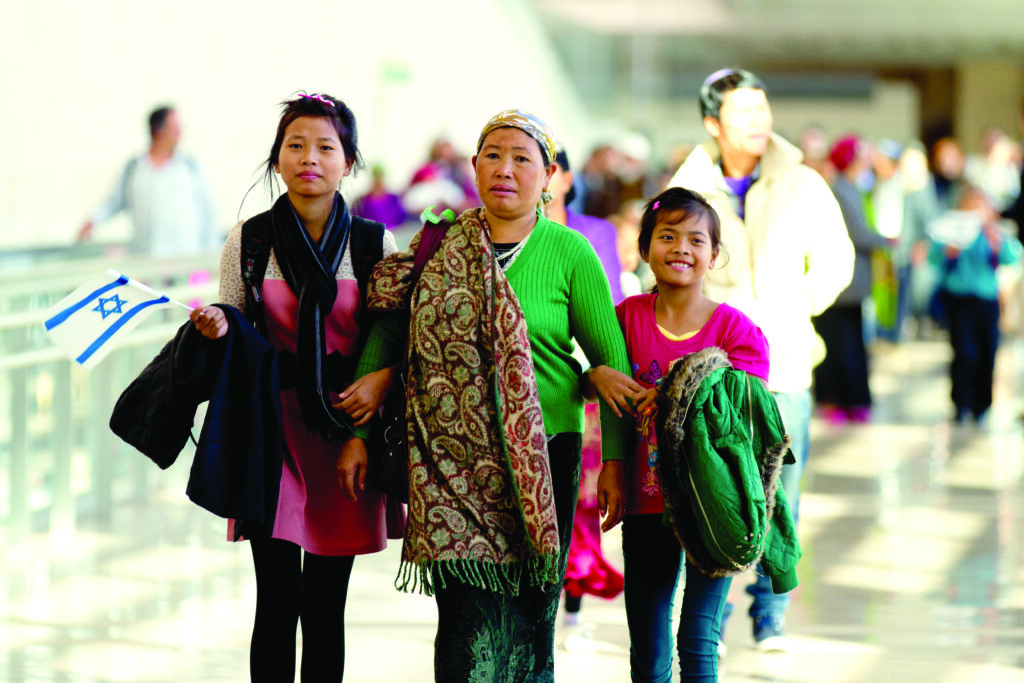 Picture of Immigrants from India arriving at airport in an article about God's end-time plan