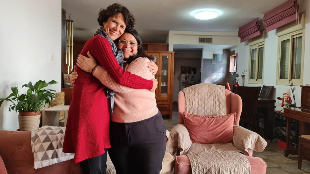 Sharing a hug are Jannie and Marlene