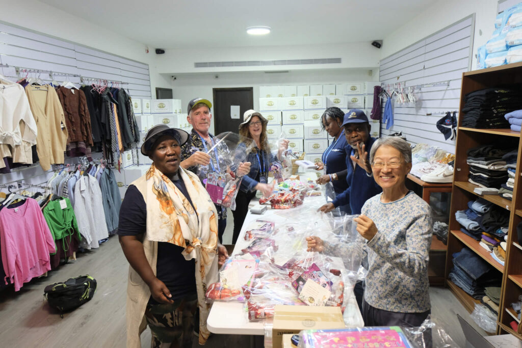 Christmas packages being prepared by the members from the hands on tour