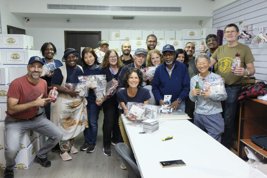 Smiling with joy are the hands on tour members as they serve