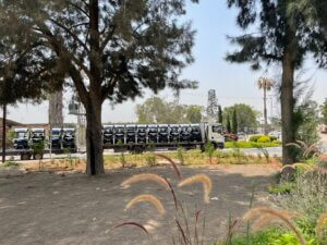 Picture shows truck delivering golf cart caddies