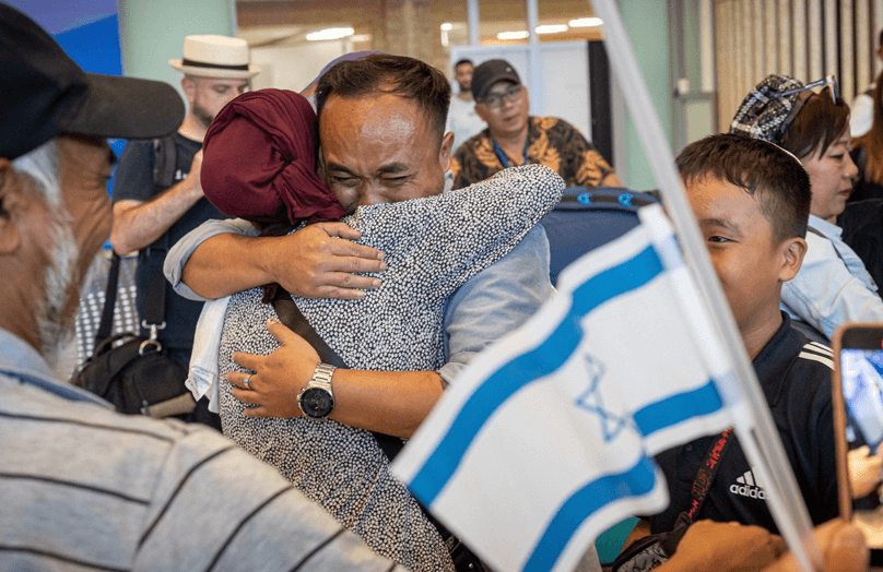 Ahron Hanghal embraces his mother Dina upon seeing her for the first time at Bnei Menashe airport