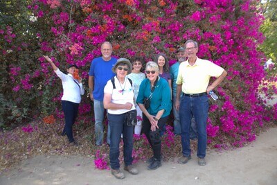 Outside Kibbutz Urim Horse Therapy Center tour members smile for a photo