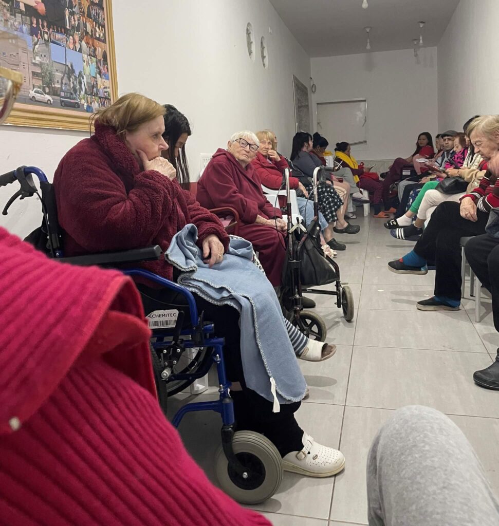Holocaust survivors remember the Holocaust as they comfort each other in a bomb shelter