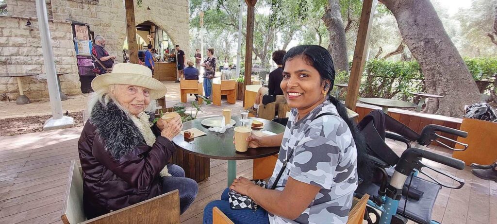 Rita enjoys a cup of coffee with her caregiver at a new café