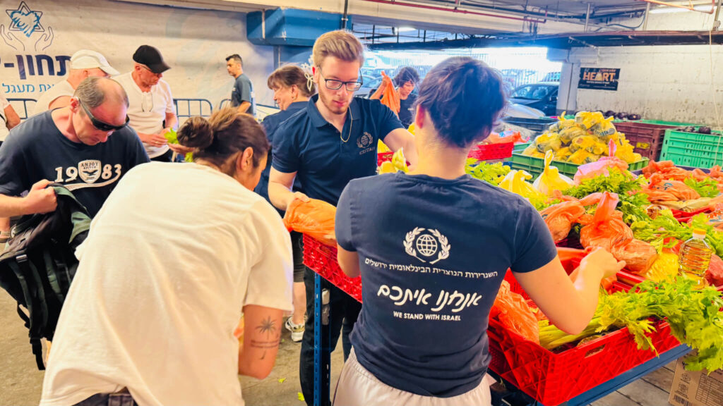 ICEJ staff serve in distributing food to Israelis