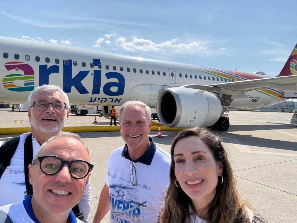 Dominique-Pierre Walter, Robert Baxter, Philippe Gablin (ICEJ), and Danielle Mor (JAFI) ready to board the Aliyah flight